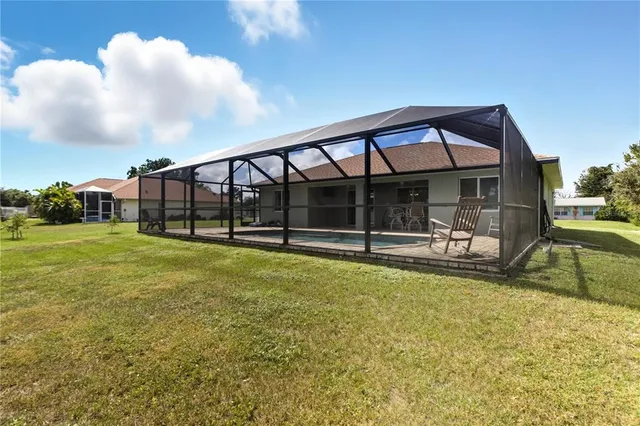 a view of a yard with an outdoor seating