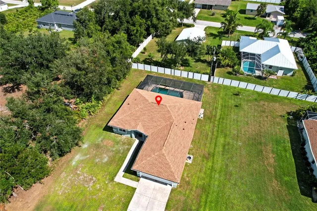 an aerial view of a house with a garden