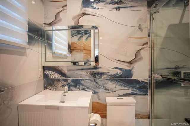 a bathroom with a sink and mirror