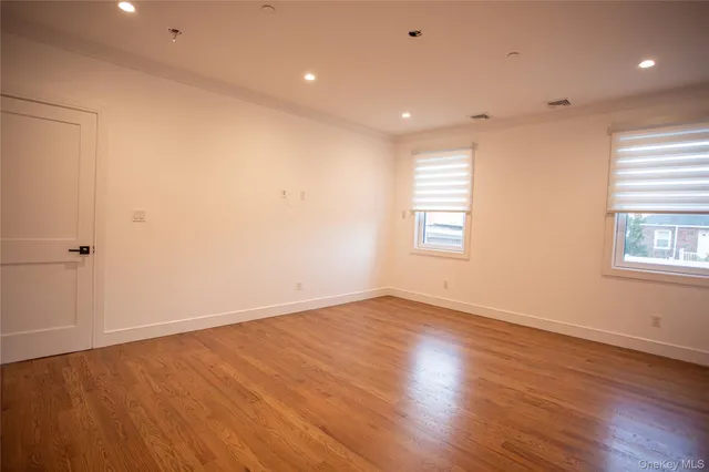 a view of a balcony with wooden floor