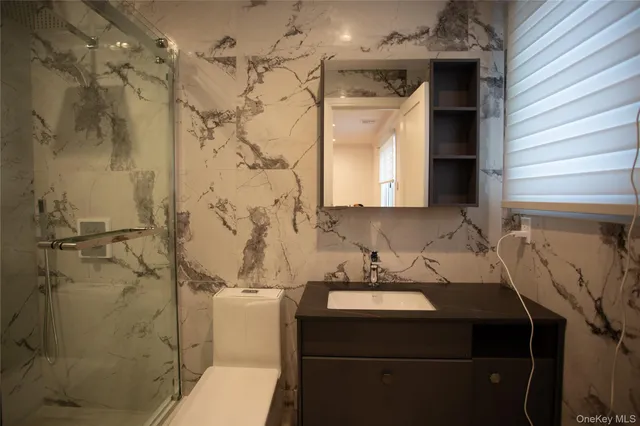 a view of a storage & utility room with a washer dryer