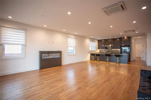 a view of kitchen with cabinets and wooden floor