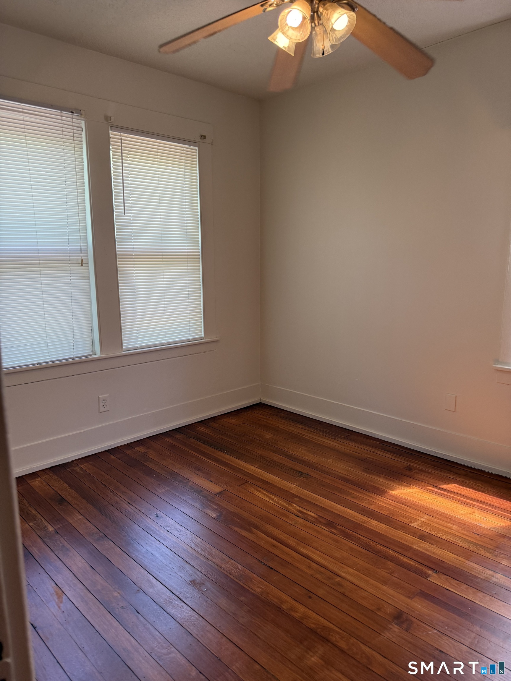 38 Read Street New Haven, CT 06511 - Photo 9 of 10 an empty room with wooden floor and windows