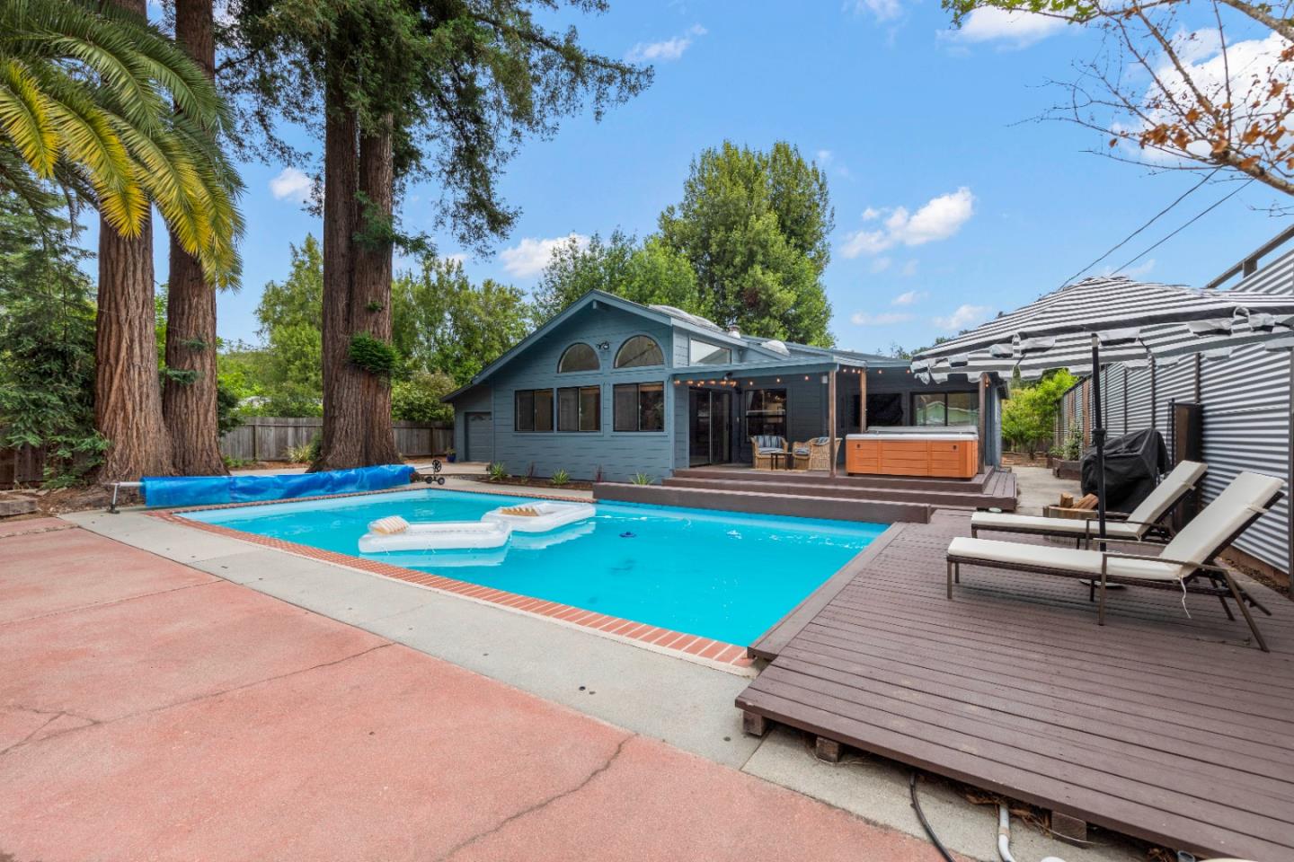 210 Madrona Way Ben Lomond, CA 95005 - Photo 1 of 56 a swimming pool with outdoor seating and yard