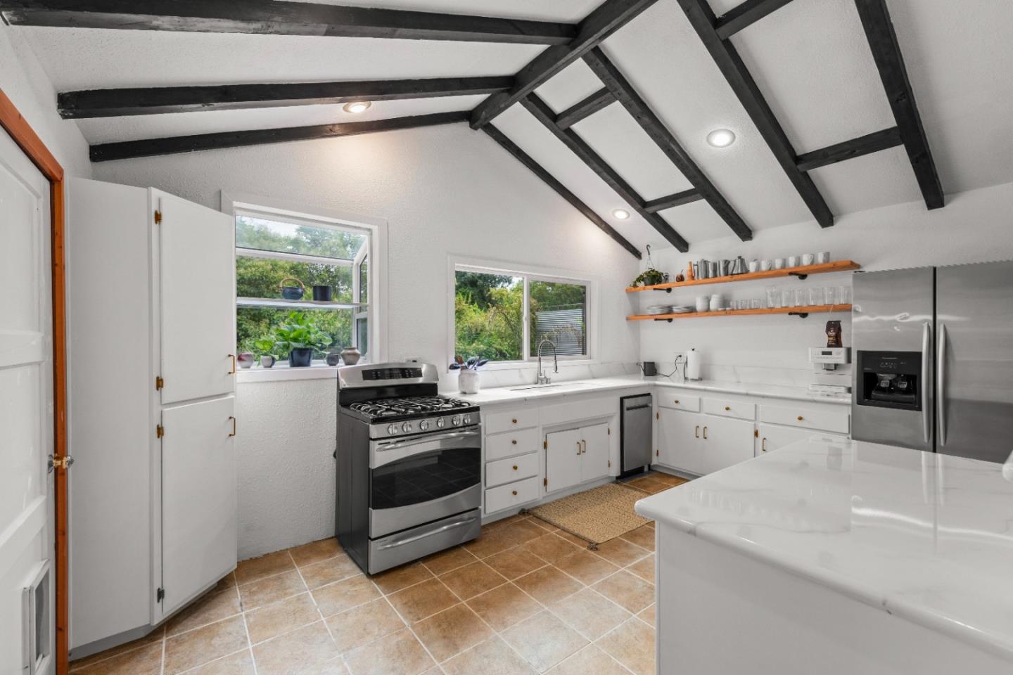210 Madrona Way Ben Lomond, CA 95005 - Photo 17 of 56 a kitchen with sink cabinets and window