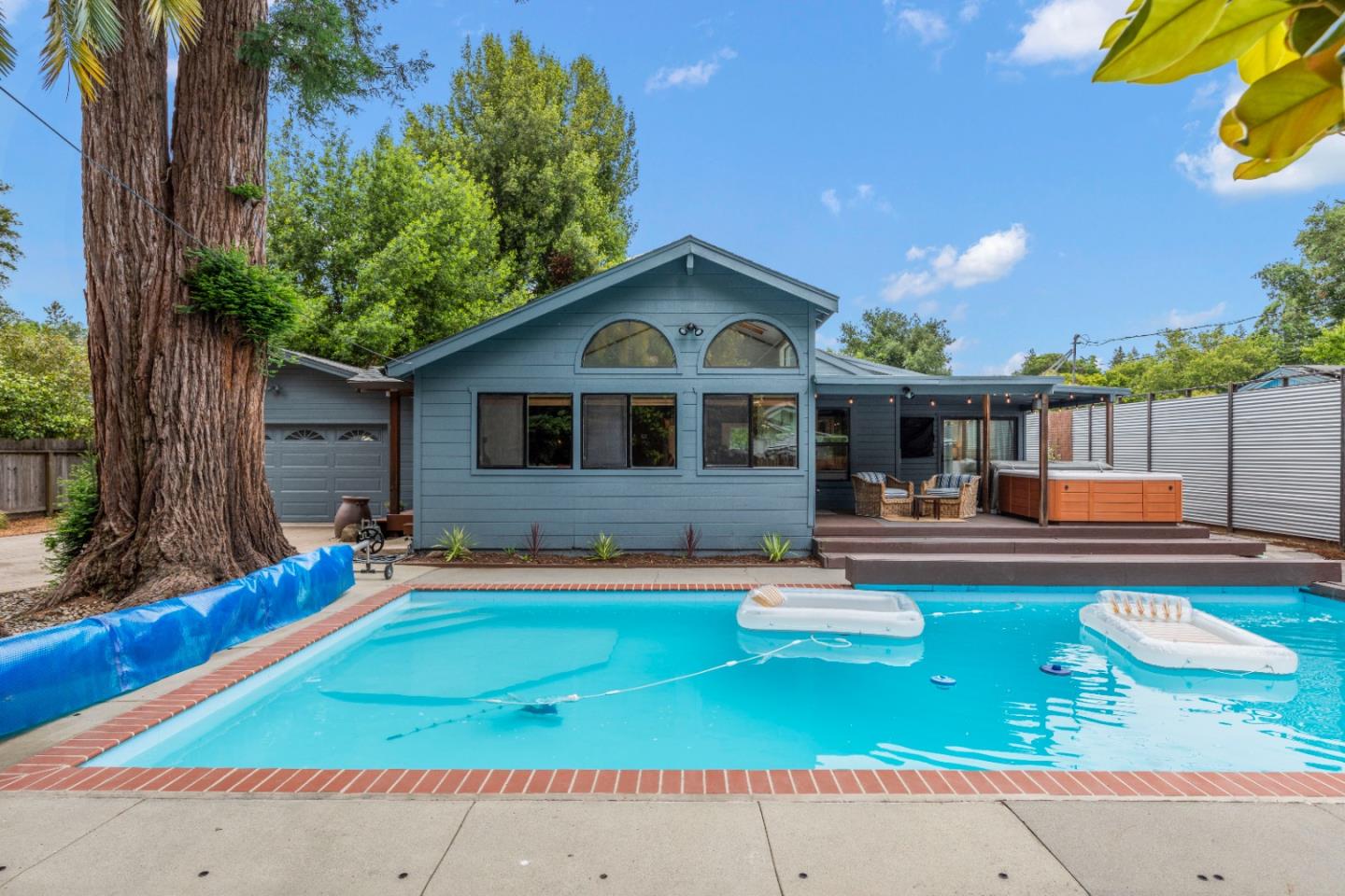 210 Madrona Way Ben Lomond, CA 95005 - Photo 2 of 56 a view of a house with pool and chairs