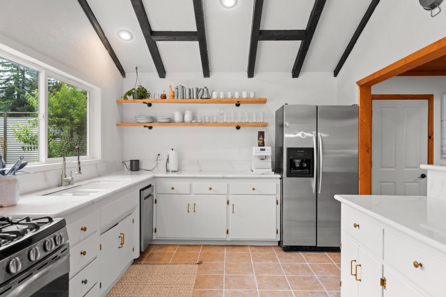 210 Madrona Way Ben Lomond, CA 95005 - Photo 21 of 56 a kitchen with cabinets and window