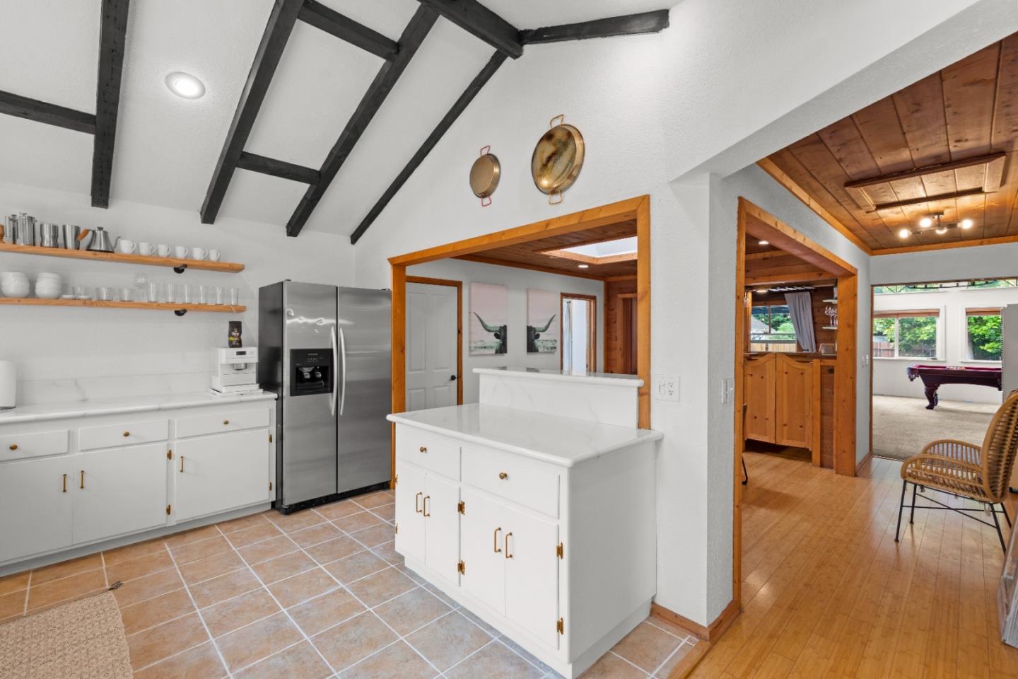 210 Madrona Way Ben Lomond, CA 95005 - Photo 23 of 56 a kitchen with cabinets and wooden floor