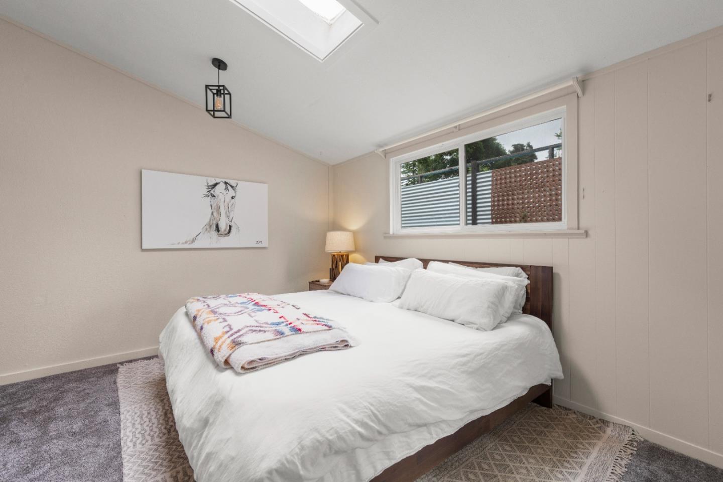 210 Madrona Way Ben Lomond, CA 95005 - Photo 24 of 56 a bedroom with a bed and a window