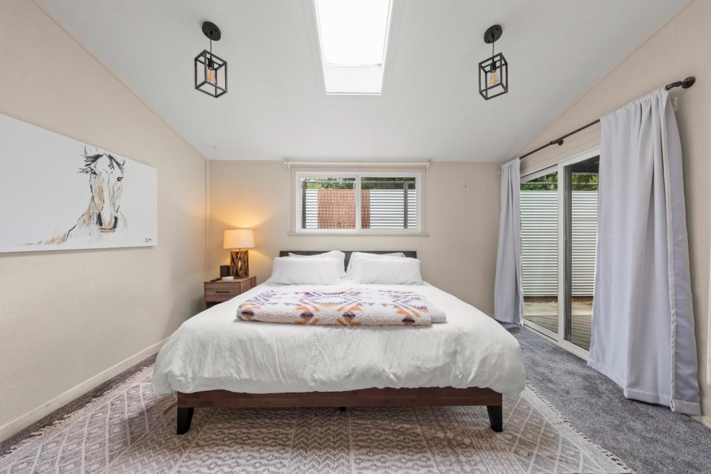 210 Madrona Way Ben Lomond, CA 95005 - Photo 25 of 56 a bedroom with a bed and wooden floor