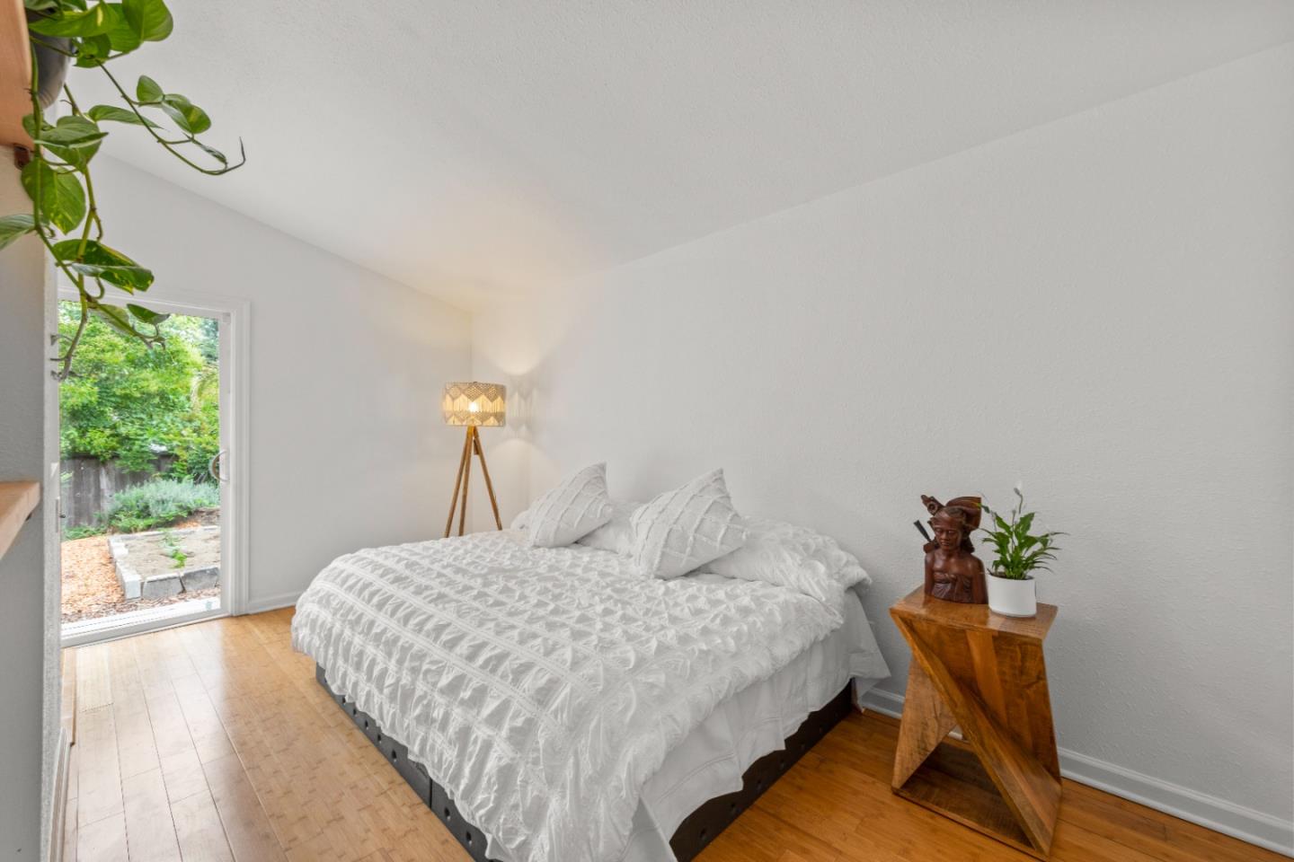210 Madrona Way Ben Lomond, CA 95005 - Photo 27 of 56 a bedroom with a bed and a potted plant