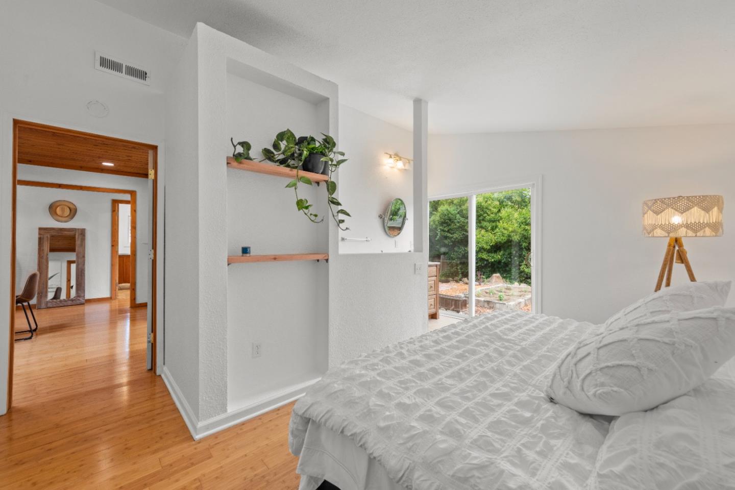 210 Madrona Way Ben Lomond, CA 95005 - Photo 28 of 56 a bedroom with a large bed and a large window