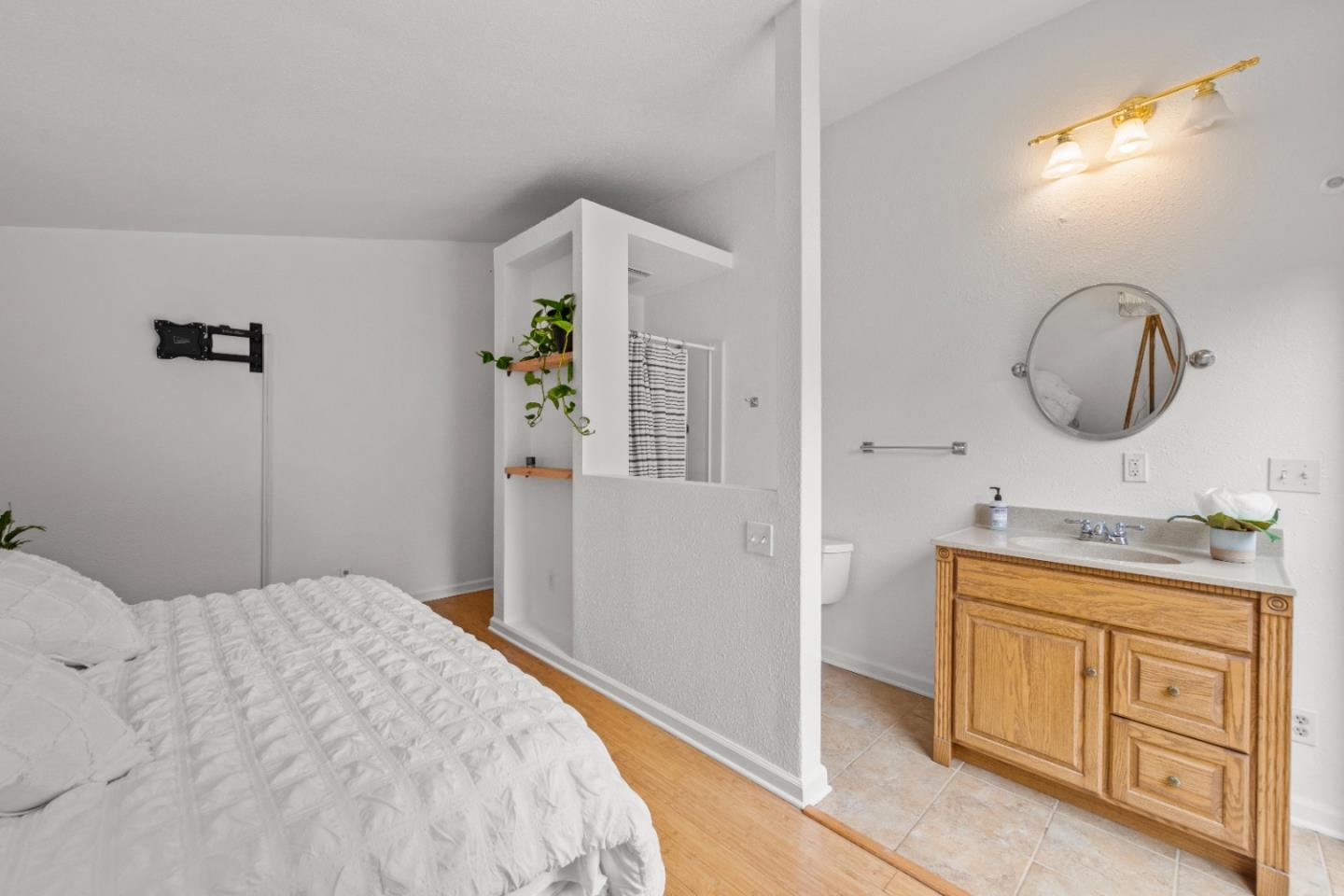 210 Madrona Way Ben Lomond, CA 95005 - Photo 29 of 56 a bedroom with a double vanity sink and a mirror