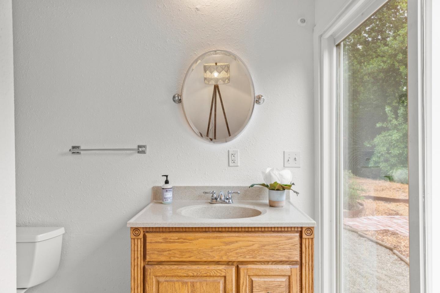 210 Madrona Way Ben Lomond, CA 95005 - Photo 30 of 56 a bathroom with a sink and a mirror