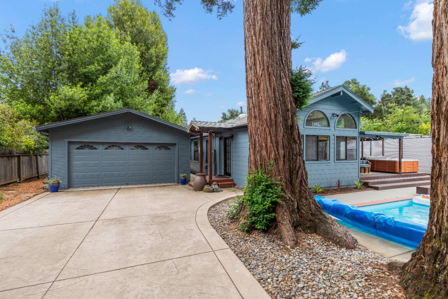 210 Madrona Way Ben Lomond, CA 95005 - Photo 3 of 56 a front view of a house with garden
