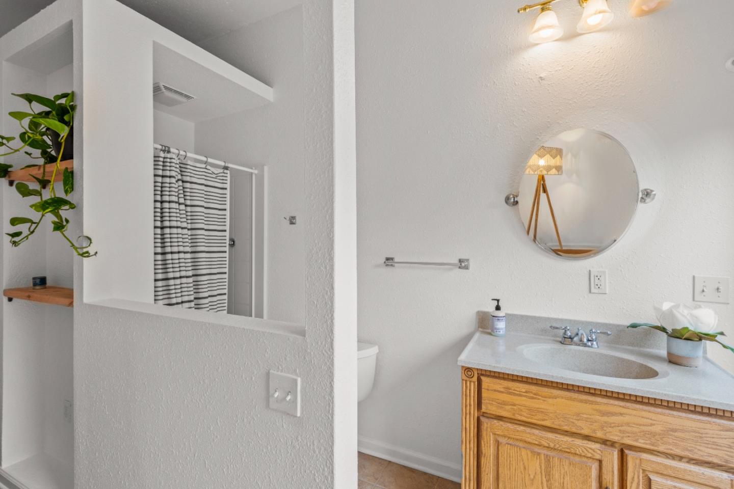 210 Madrona Way Ben Lomond, CA 95005 - Photo 31 of 56 a bathroom with a sink and a mirror