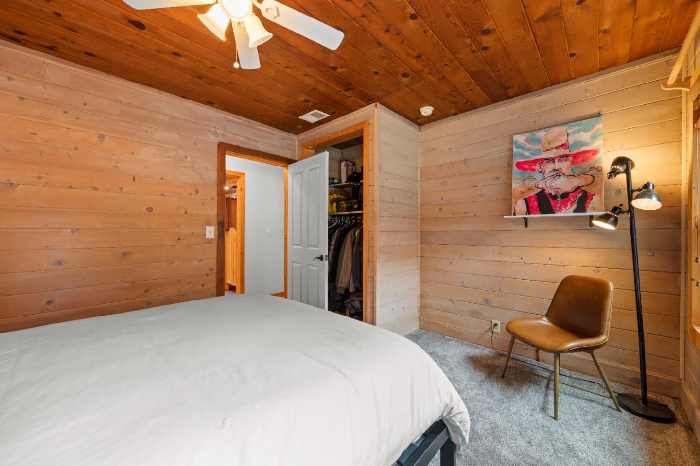 210 Madrona Way Ben Lomond, CA 95005 - Photo 34 of 56 a bedroom with a bed and a chair