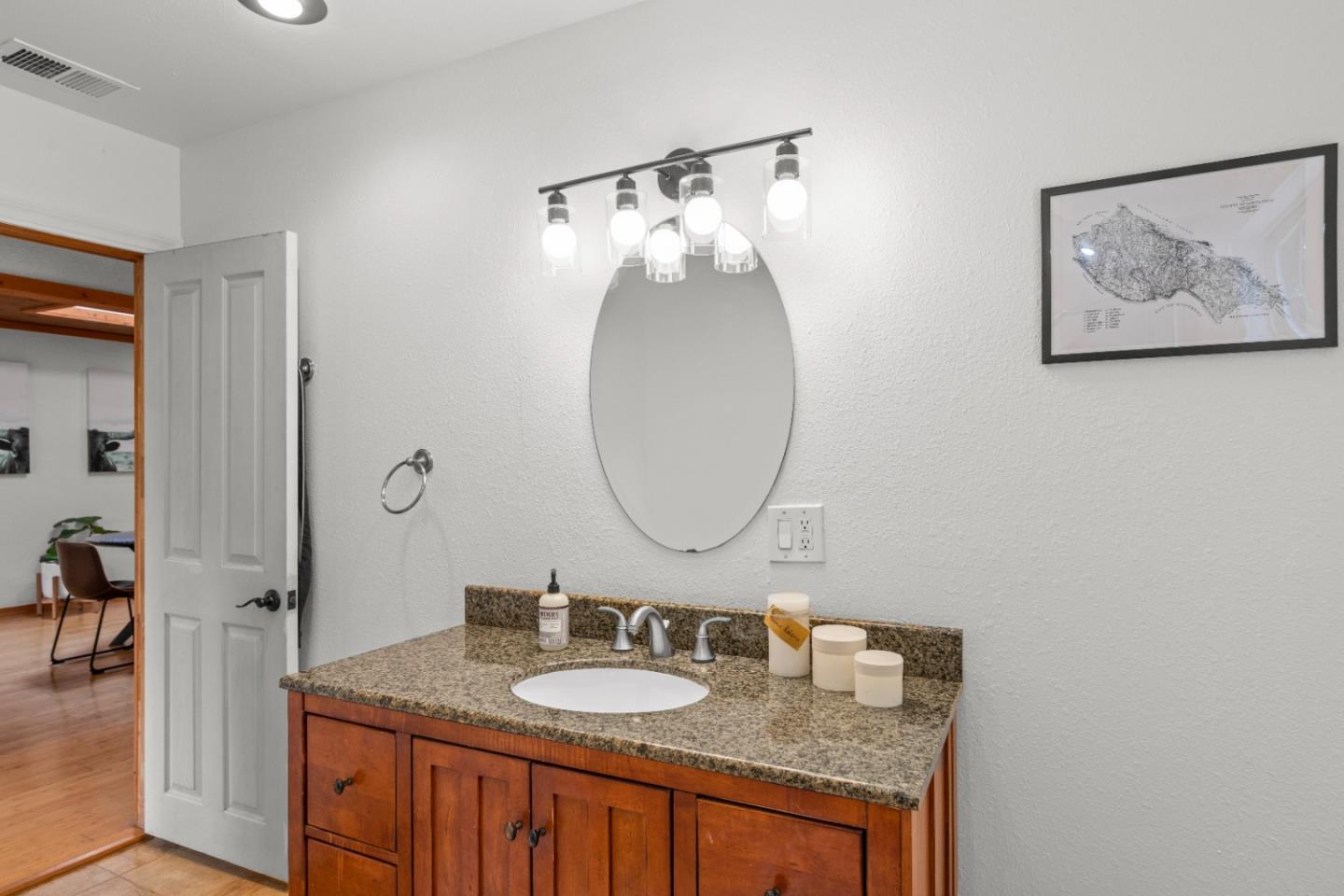 210 Madrona Way Ben Lomond, CA 95005 - Photo 36 of 56 a bathroom with a granite countertop sink and a mirror