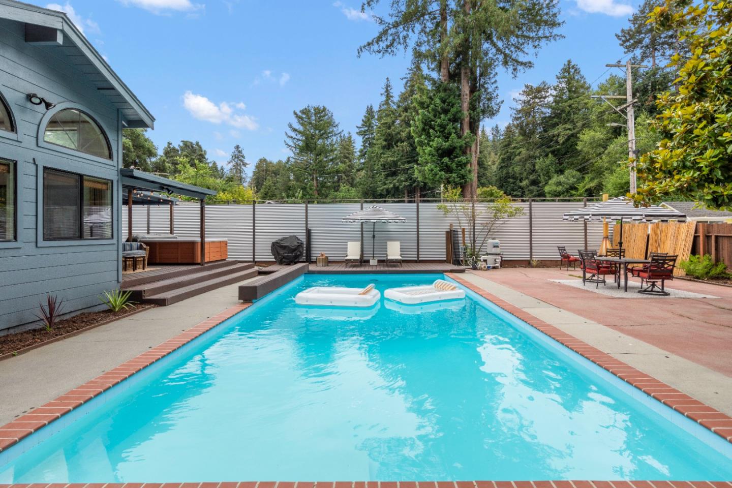 210 Madrona Way Ben Lomond, CA 95005 - Photo 39 of 56 a swimming pool with outdoor seating
