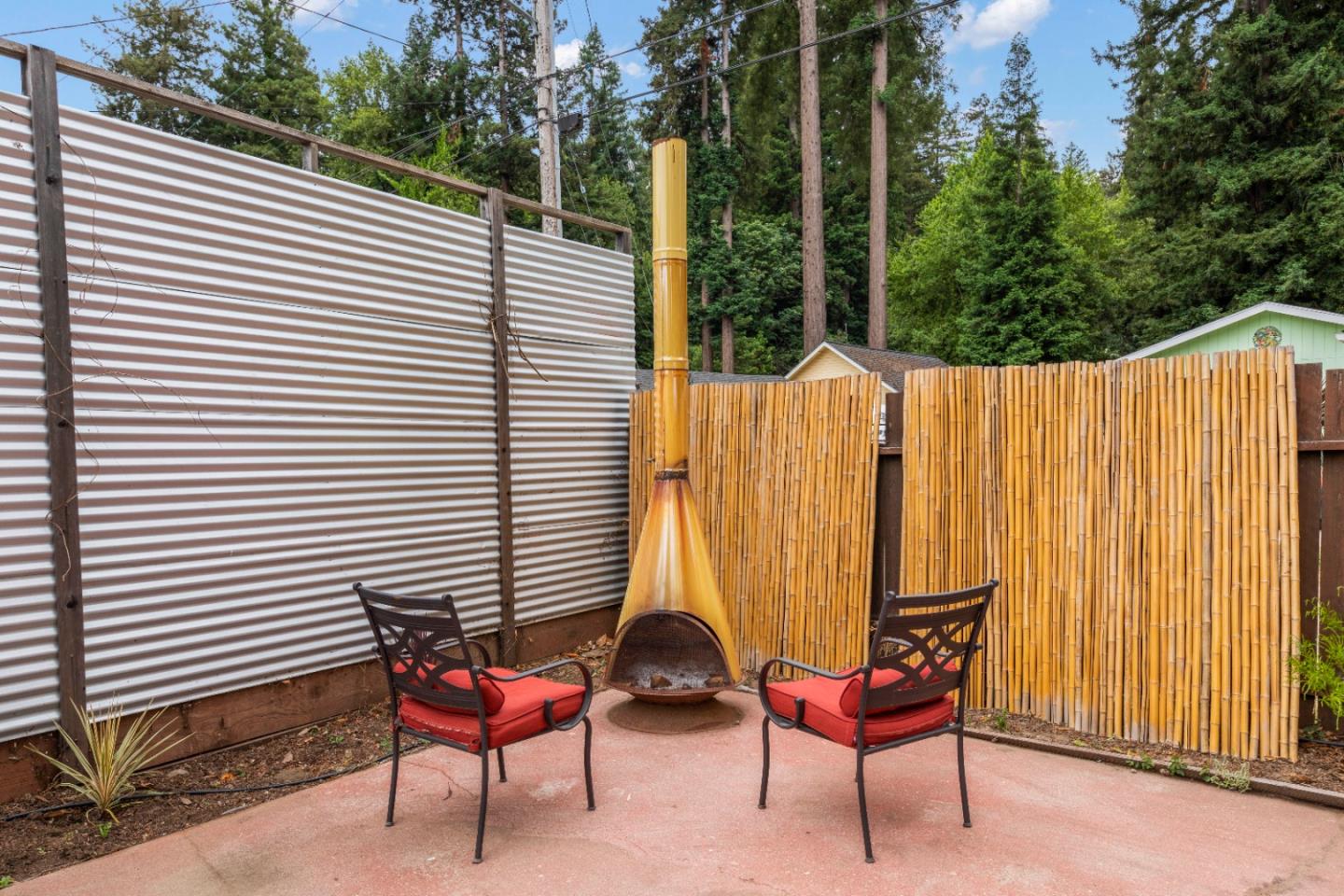 210 Madrona Way Ben Lomond, CA 95005 - Photo 43 of 56 a backyard of a house with table and chairs