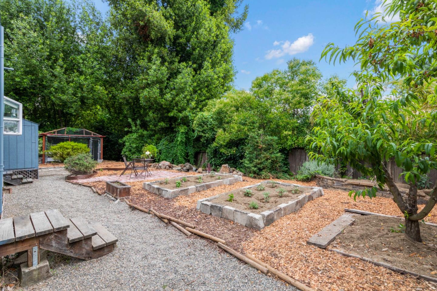 210 Madrona Way Ben Lomond, CA 95005 - Photo 44 of 56 a backyard of a house with barbeque oven table and chairs