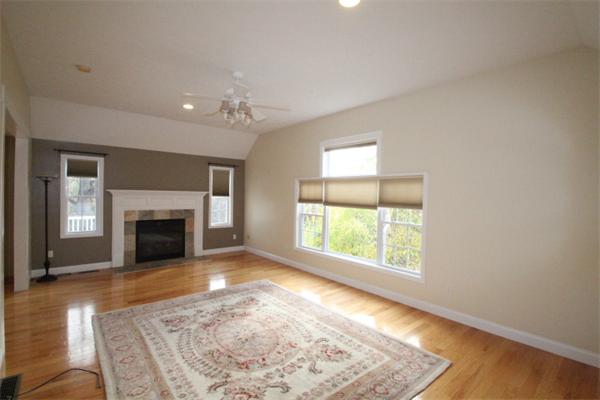 123 Clark Road Shirley, MA 01464 - Photo 12 of 24 an empty room with windows and fireplace