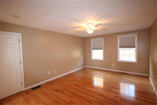 123 Clark Road Shirley, MA 01464 - Photo 13 of 24 an empty room with wooden floor and window