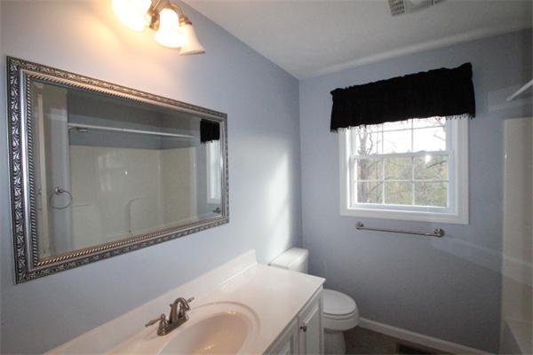 123 Clark Road Shirley, MA 01464 - Photo 17 of 24 a bathroom with a sink and a mirror
