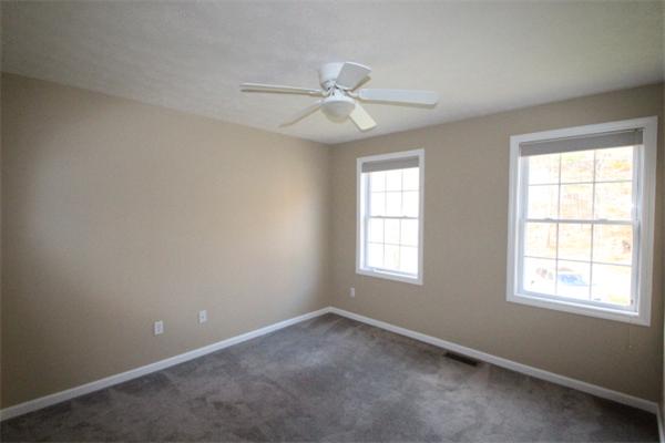 123 Clark Road Shirley, MA 01464 - Photo 19 of 24 an empty room with windows and fan