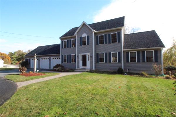 123 Clark Road Shirley, MA 01464 - Photo 24 of 24 a front view of a house with a garden and trees