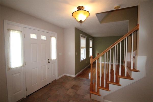 123 Clark Road Shirley, MA 01464 - Photo 3 of 24 a view of staircase with railing and a chandelier