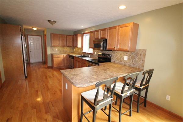 123 Clark Road Shirley, MA 01464 - Photo 7 of 24 a view of a dining room with furniture and a large window
