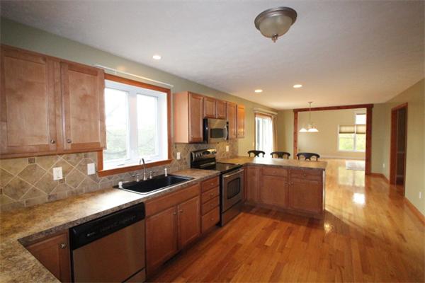 123 Clark Road Shirley, MA 01464 - Photo 8 of 24 a kitchen with sink a stove and cabinets
