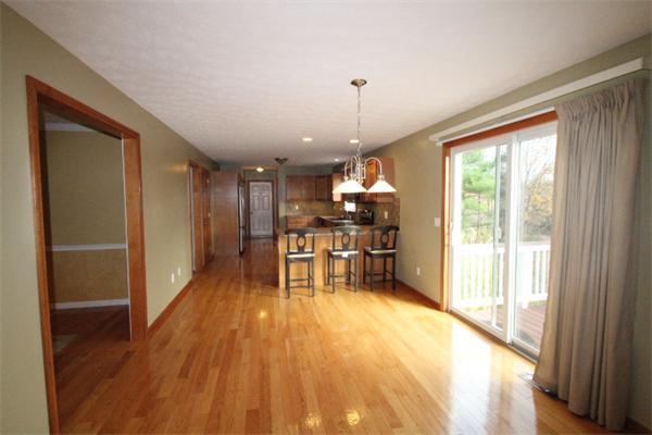 123 Clark Road Shirley, MA 01464 - Photo 10 of 24 a view of a room with wooden floor outdoor seating and a window