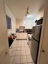 a kitchen with stainless steel appliances granite countertop a refrigerator sink and microwave