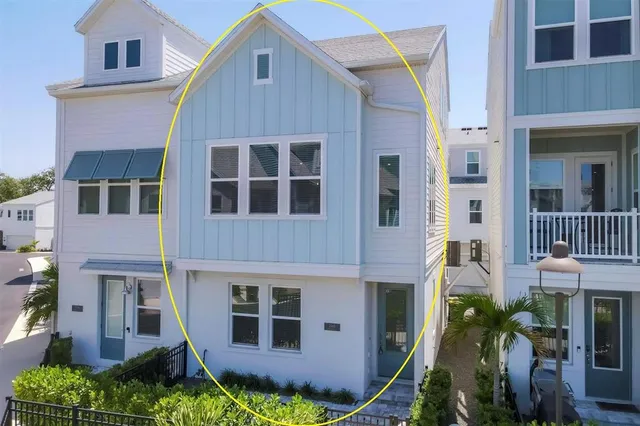 a view of staircase with railing and white walls