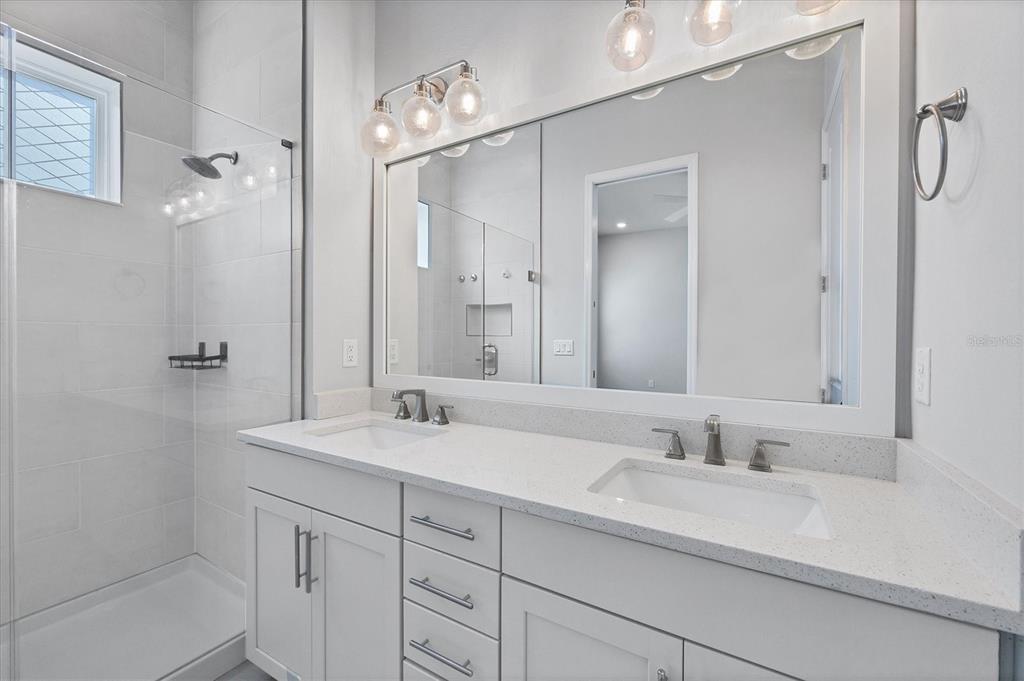 2340 Lindstrom Street Sarasota, FL 34237 - Photo 18 of 59 a bathroom with a double vanity sink mirror and double