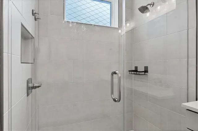 a view of a city with lawn chairs and swimming pool