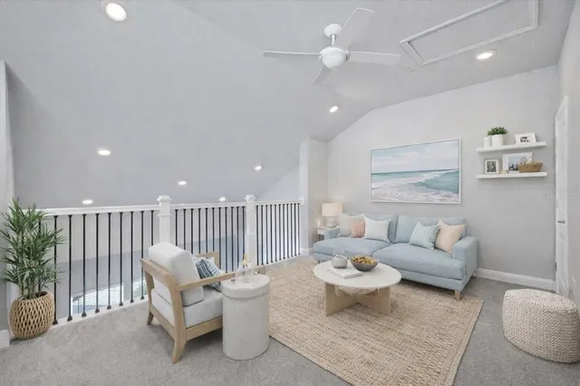 a view of a building with a swimming pool and sitting area