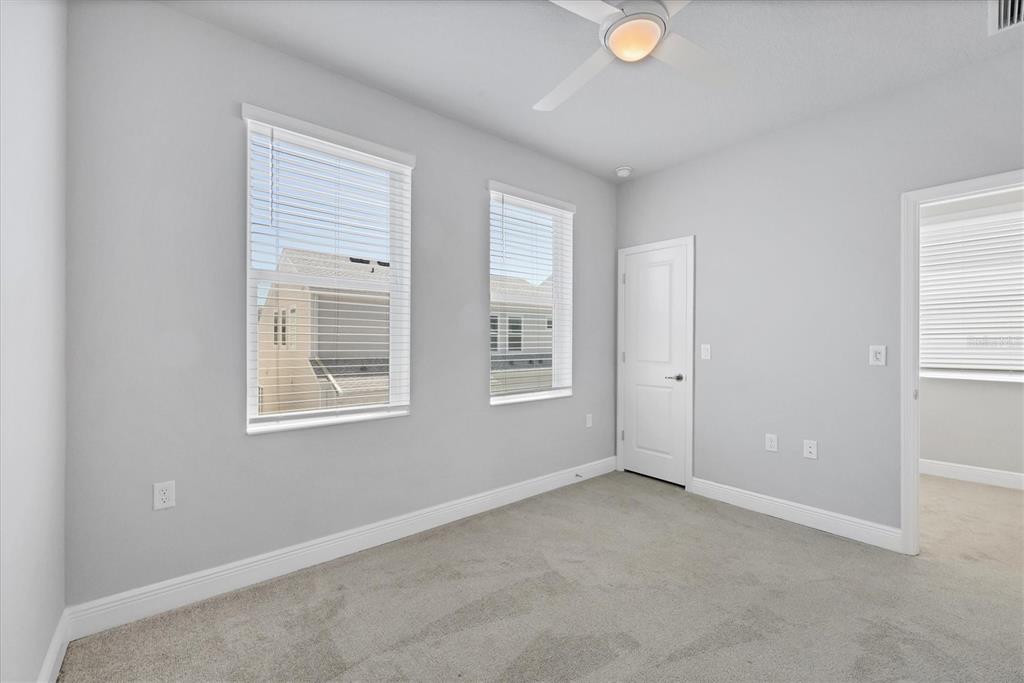 2340 Lindstrom Street Sarasota, FL 34237 - Photo 25 of 59 an empty room with windows and closet