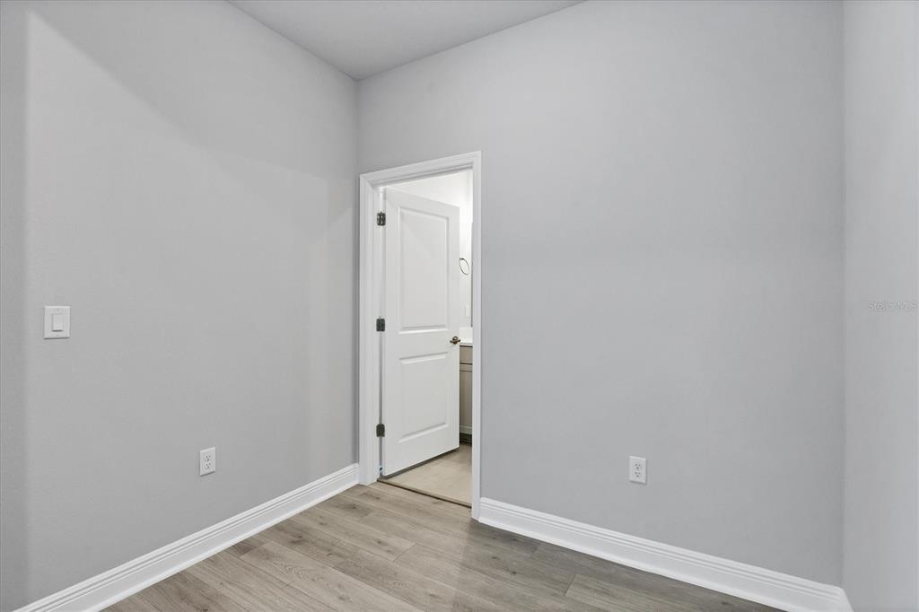 2340 Lindstrom Street Sarasota, FL 34237 - Photo 33 of 59 a view of an empty room with wooden floor