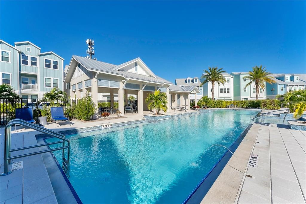 2340 Lindstrom Street Sarasota, FL 34237 - Photo 46 of 59 a view of a house with pool and a chairs