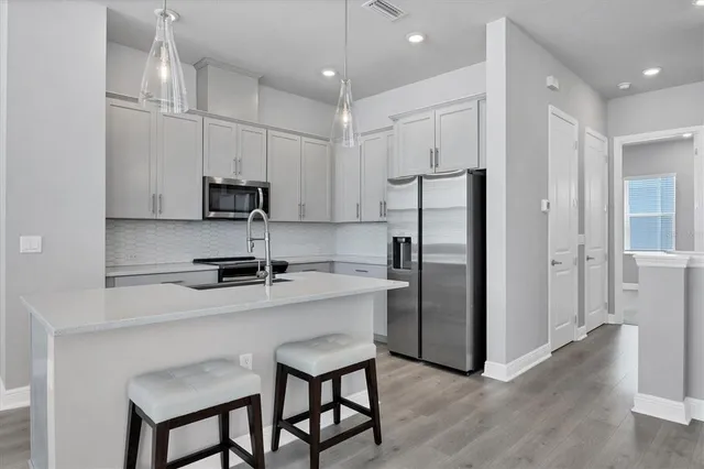 a view of an entryway with wooden floor