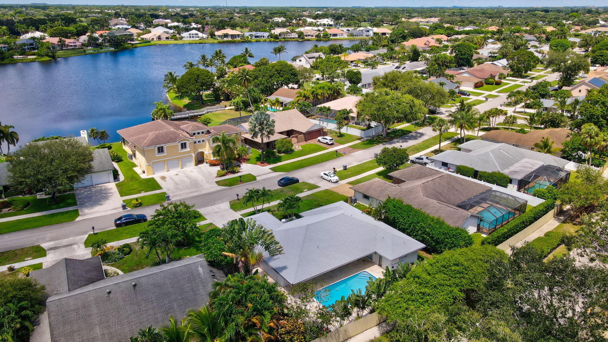 17634 Lake Park Road Boca Raton, FL 33487 - Photo 50 of 62 an aerial view of a house with a garden and lake view
