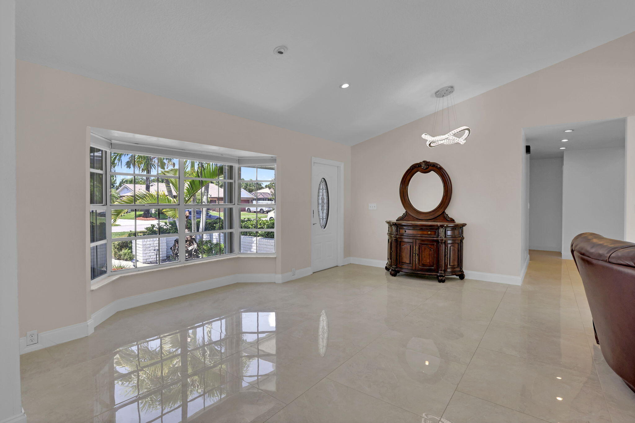 17634 Lake Park Road Boca Raton, FL 33487 - Photo 7 of 62 a living room with furniture and a large window