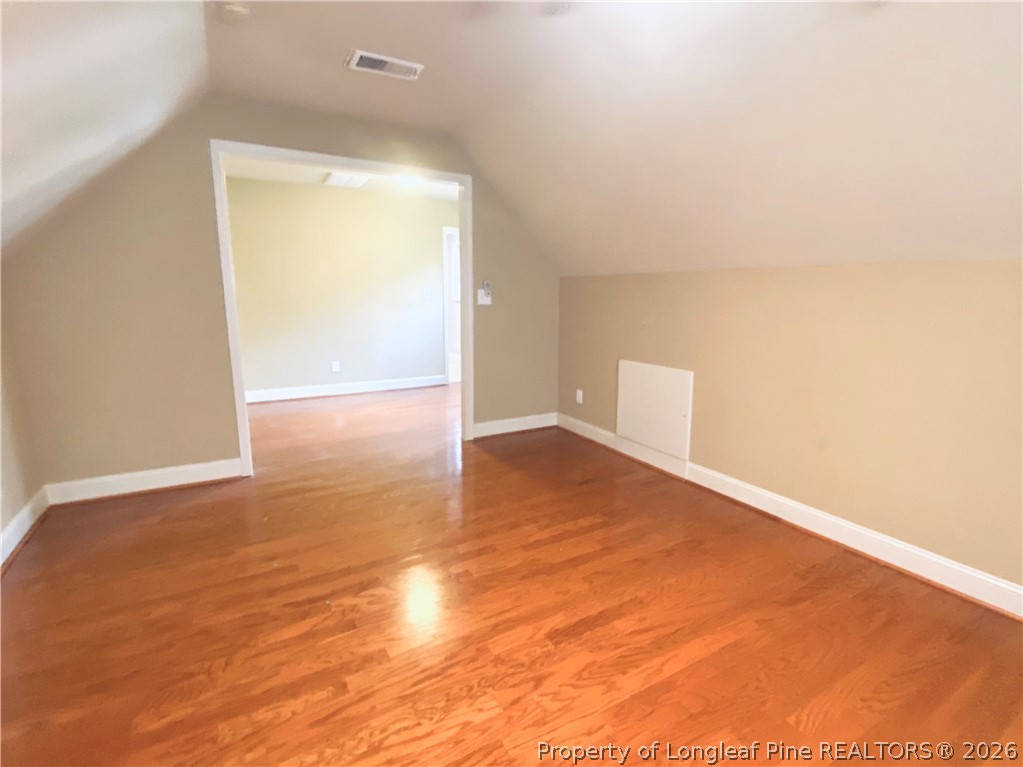 175 Pine Hawk Drive Spring Lake, NC 28390 - Photo 32 of 43 an empty room with wooden floor and windows
