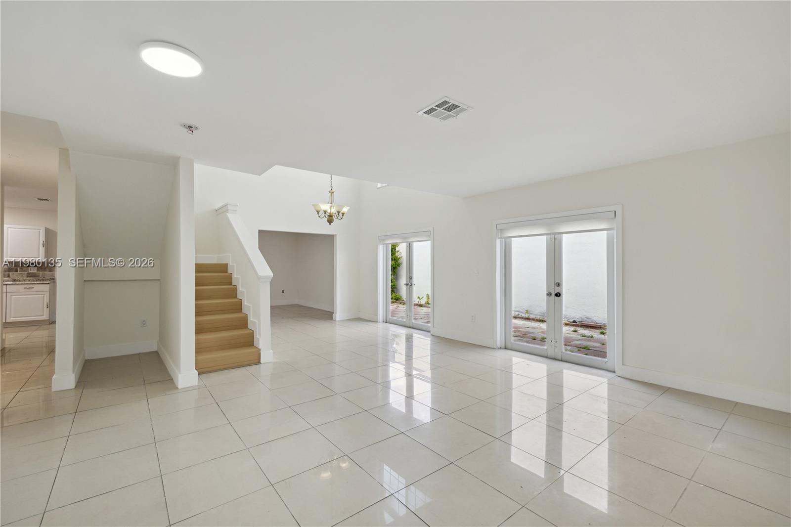 15131 Southwest 58th Street Miami, FL 33185 - Photo 2 of 19 a view of entryway and hall with a window