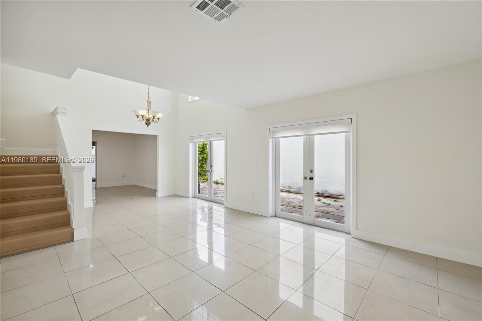 15131 Southwest 58th Street Miami, FL 33185 - Photo 3 of 19 a view of an empty room and window