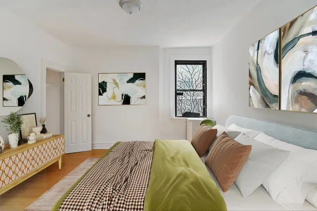 a bedroom with a bed and a couch