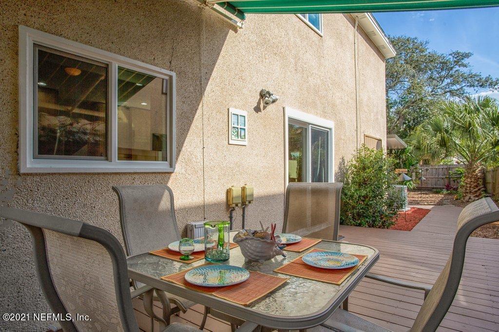 1747 Seminole Road Atlantic Beach, FL 32233 - Photo 54 of 57 a view of a patio with couches table and chairs and potted plants